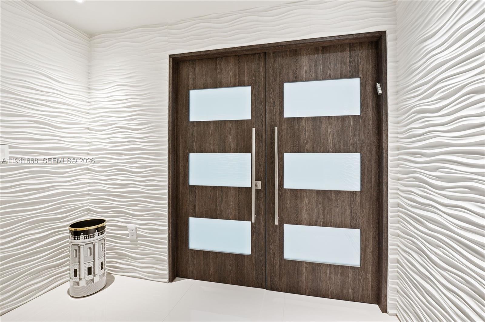 9601 Collins Avenue, Unit 908 Bal Harbour, FL 33154 - Photo 21 of 29 a picture of table and chair