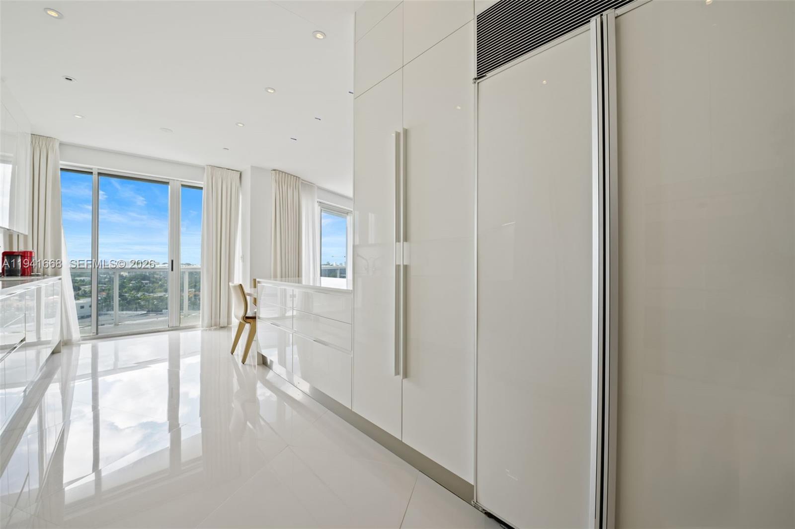 9601 Collins Avenue, Unit 908 Bal Harbour, FL 33154 - Photo 7 of 29 a view of hallway with windows