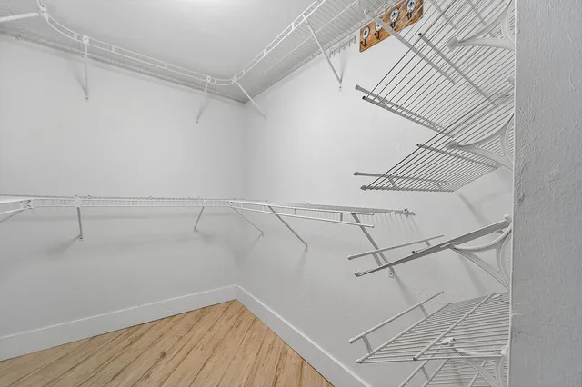 a bathroom with a sink vanity mirror and toilet