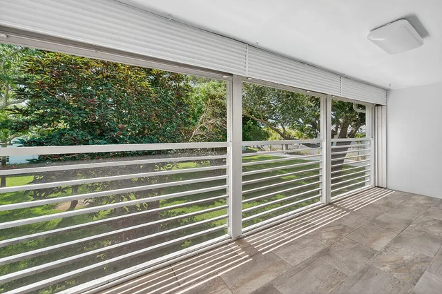 a view of a room with a large window