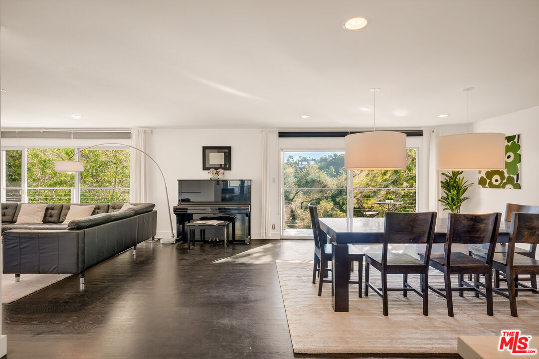 2388 Kimridge Road Beverly Hills, CA 90210 - Photo 15 of 54 a dining room with furniture window and wooden floor