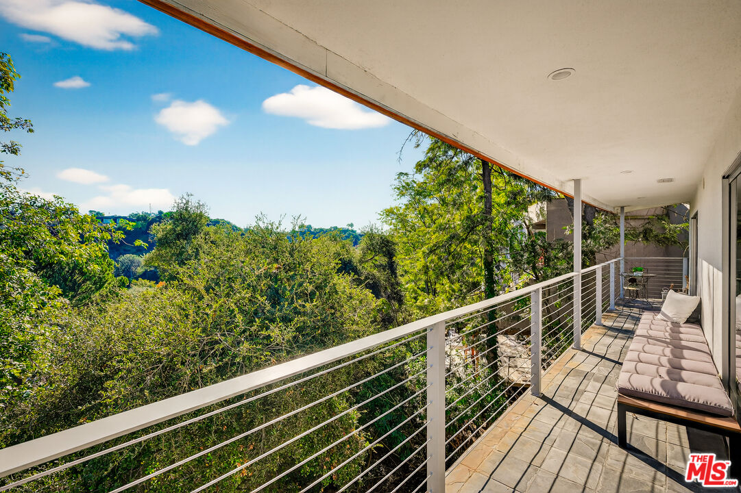2388 Kimridge Road Beverly Hills, CA 90210 - Photo 17 of 54 a view of balcony with wooden floor