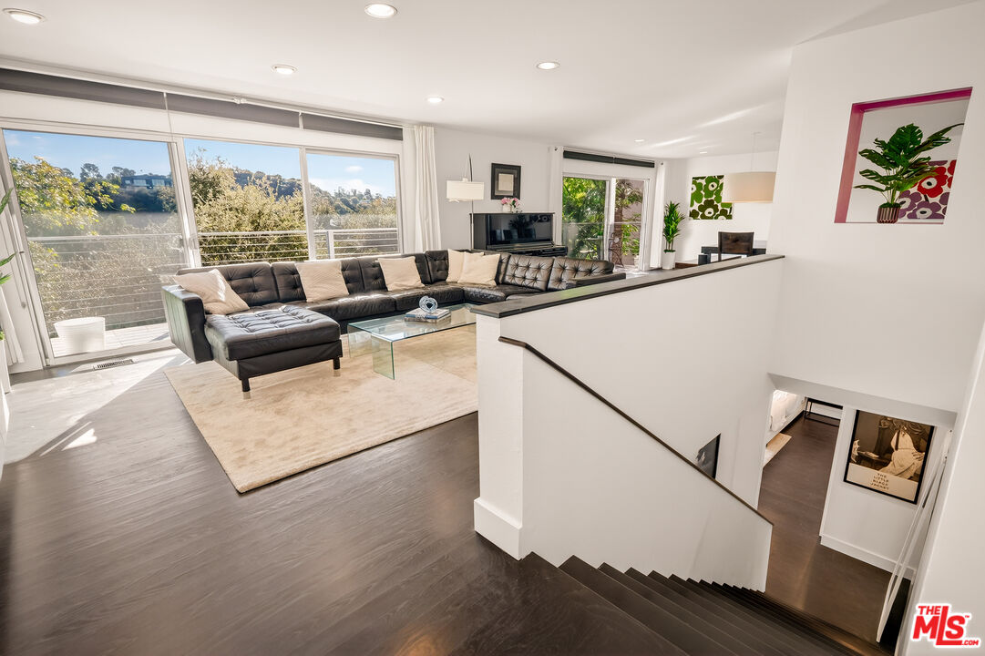 2388 Kimridge Road Beverly Hills, CA 90210 - Photo 19 of 54 a living room with furniture and a large window