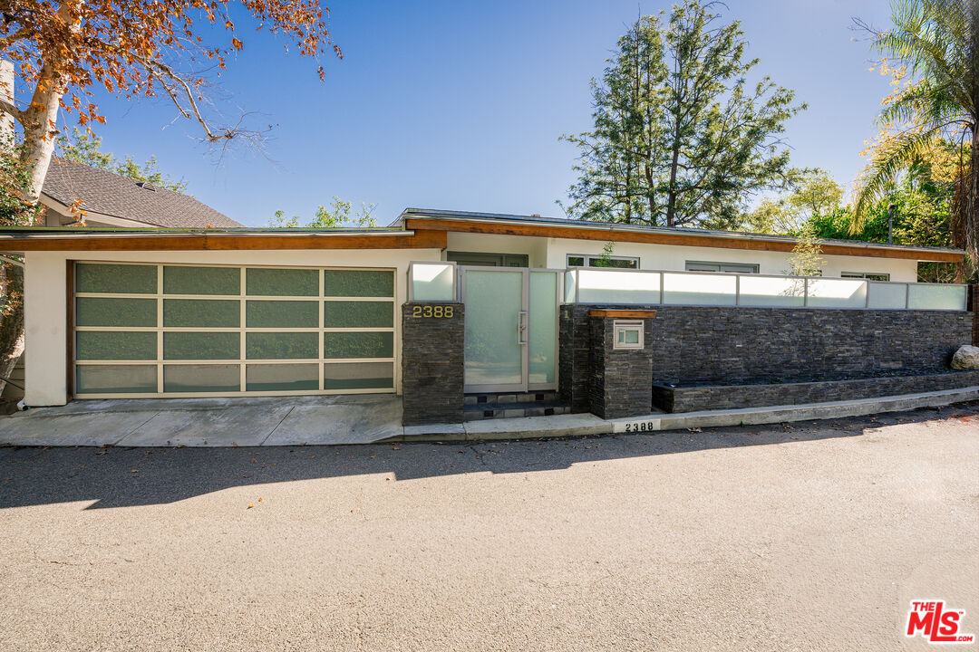 2388 Kimridge Road Beverly Hills, CA 90210 - Photo 2 of 54 a view of front door and garage