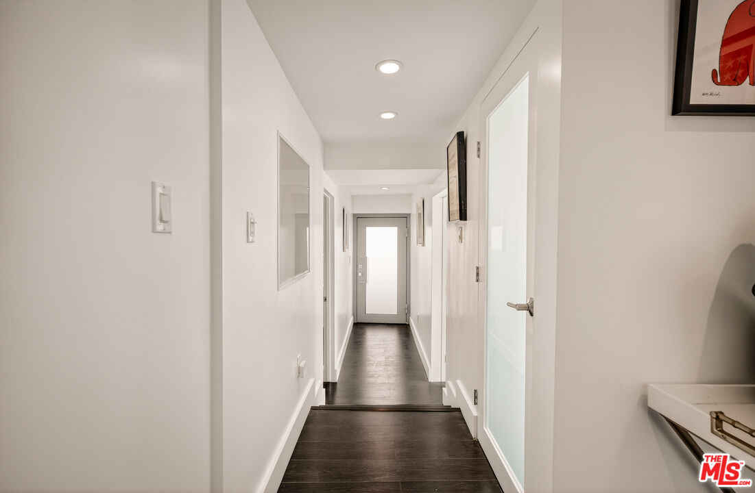 2388 Kimridge Road Beverly Hills, CA 90210 - Photo 35 of 54 a view of hallway with wooden floor