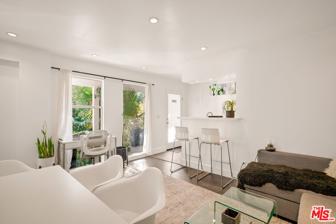 2388 Kimridge Road Beverly Hills, CA 90210 - Photo 41 of 54 a living room with furniture and a large window