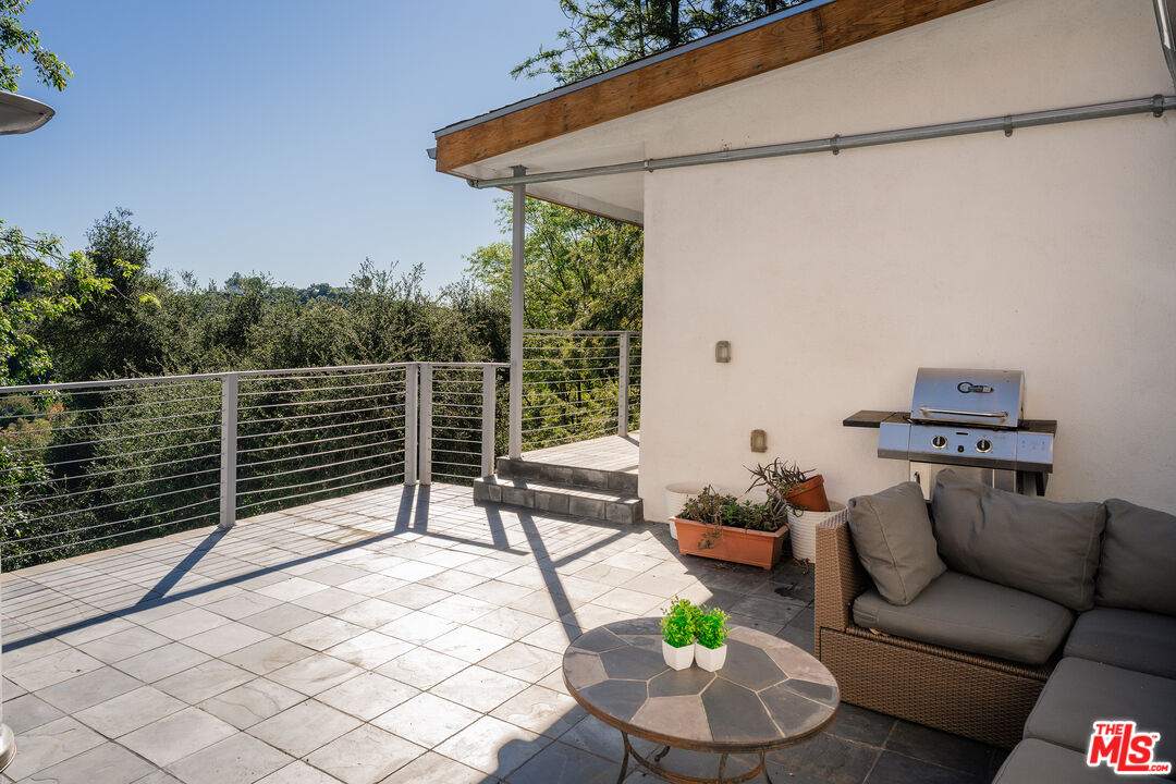 2388 Kimridge Road Beverly Hills, CA 90210 - Photo 50 of 54 a building outdoor space with patio furniture