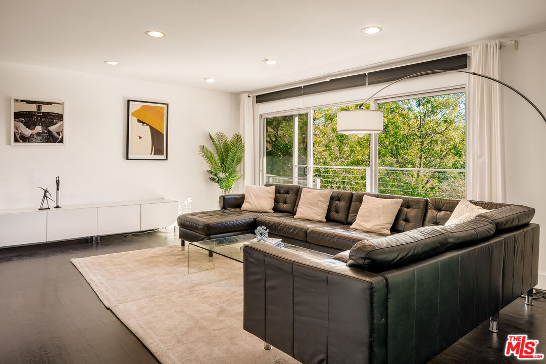 2388 Kimridge Road Beverly Hills, CA 90210 - Photo 6 of 54 a living room with furniture and a large window