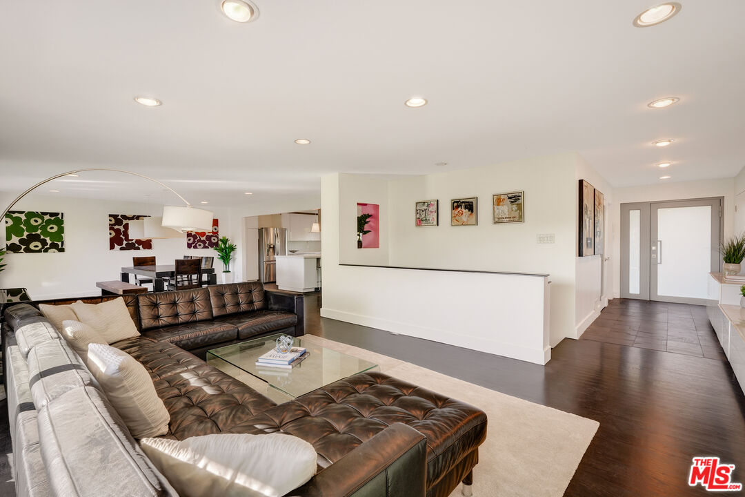 2388 Kimridge Road Beverly Hills, CA 90210 - Photo 7 of 54 a living room with furniture and a wooden floor