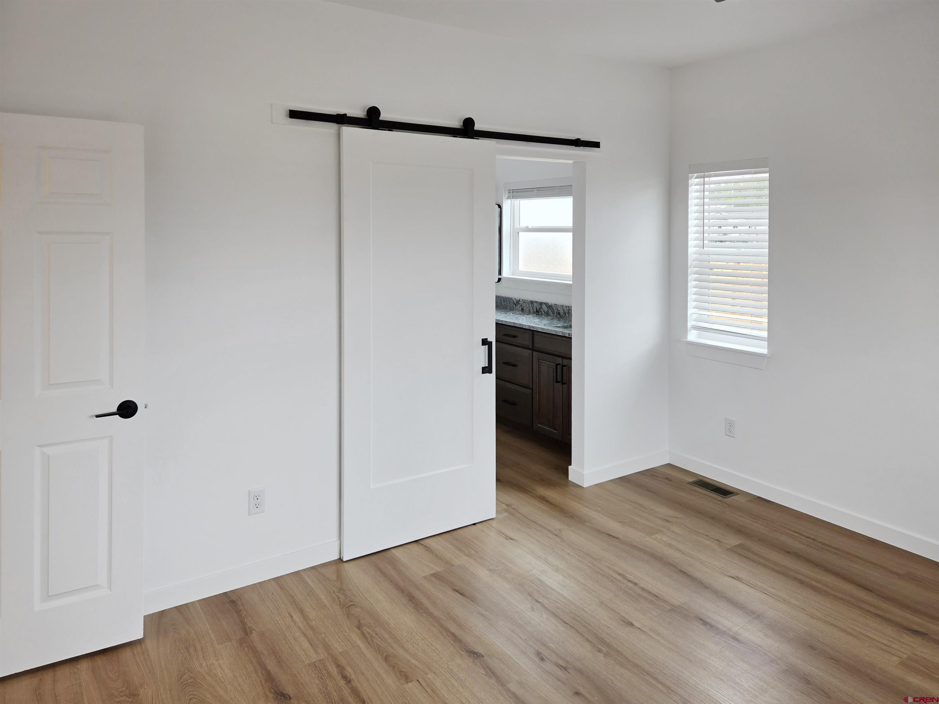 1456 Acoma Street Cortez, CO 81321 - Photo 10 of 26 a view of an empty room with closet and a window