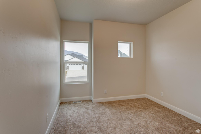 1512 West 600 North, Unit O4A Mapleton, UT 84664 - Photo 19 of 24 Unfurnished room with light carpet and baseboards