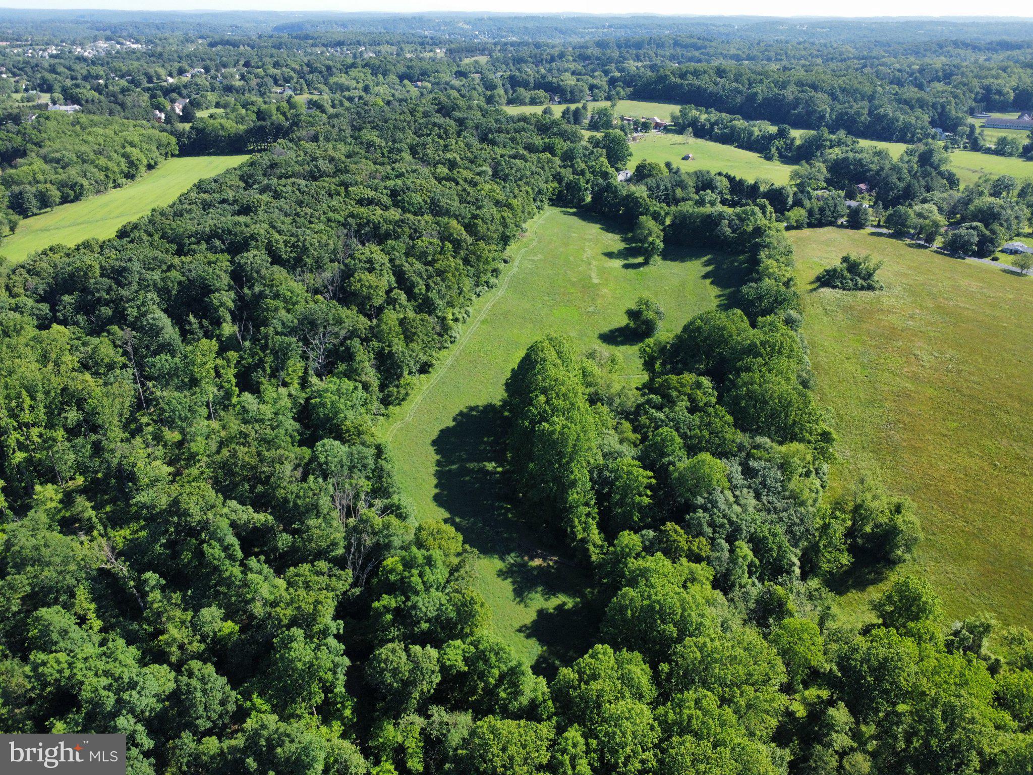 970 Doe Run Road East Fallowfield, PA 19320 - Photo 11 of 16 an aerial view of residential house with outdoor space and trees all around