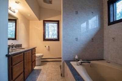 44 Flower Road East Fishkill, NY 12533 - Photo 20 of 30 a bathroom with a tub sink and mirror