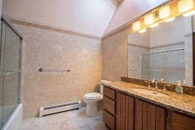 44 Flower Road East Fishkill, NY 12533 - Photo 22 of 30 a bathroom with a granite countertop sink mirror vanity and toilet