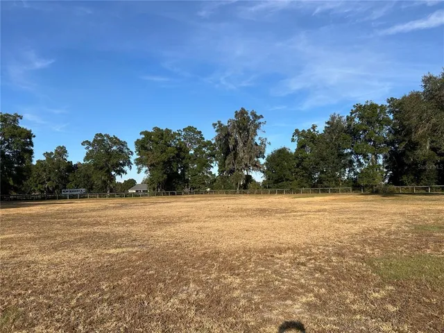 a view of swimming pool with an outdoor space and seating area
