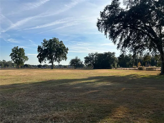a view of a swimming pool with an outdoor space and seating area