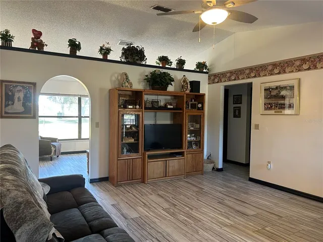 a bathroom with a granite countertop sink toilet and a mirror