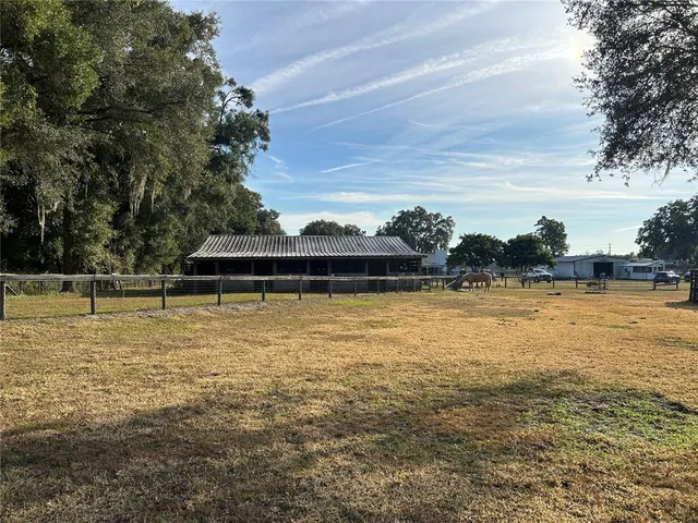a view of a water and trees from a big room
