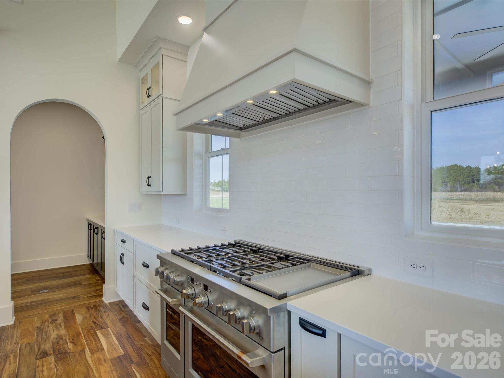 2334 Bridgewater Road, Unit 6 Rock Hill, SC 29730 - Photo 11 of 47 a kitchen with a stove and a wooden floor