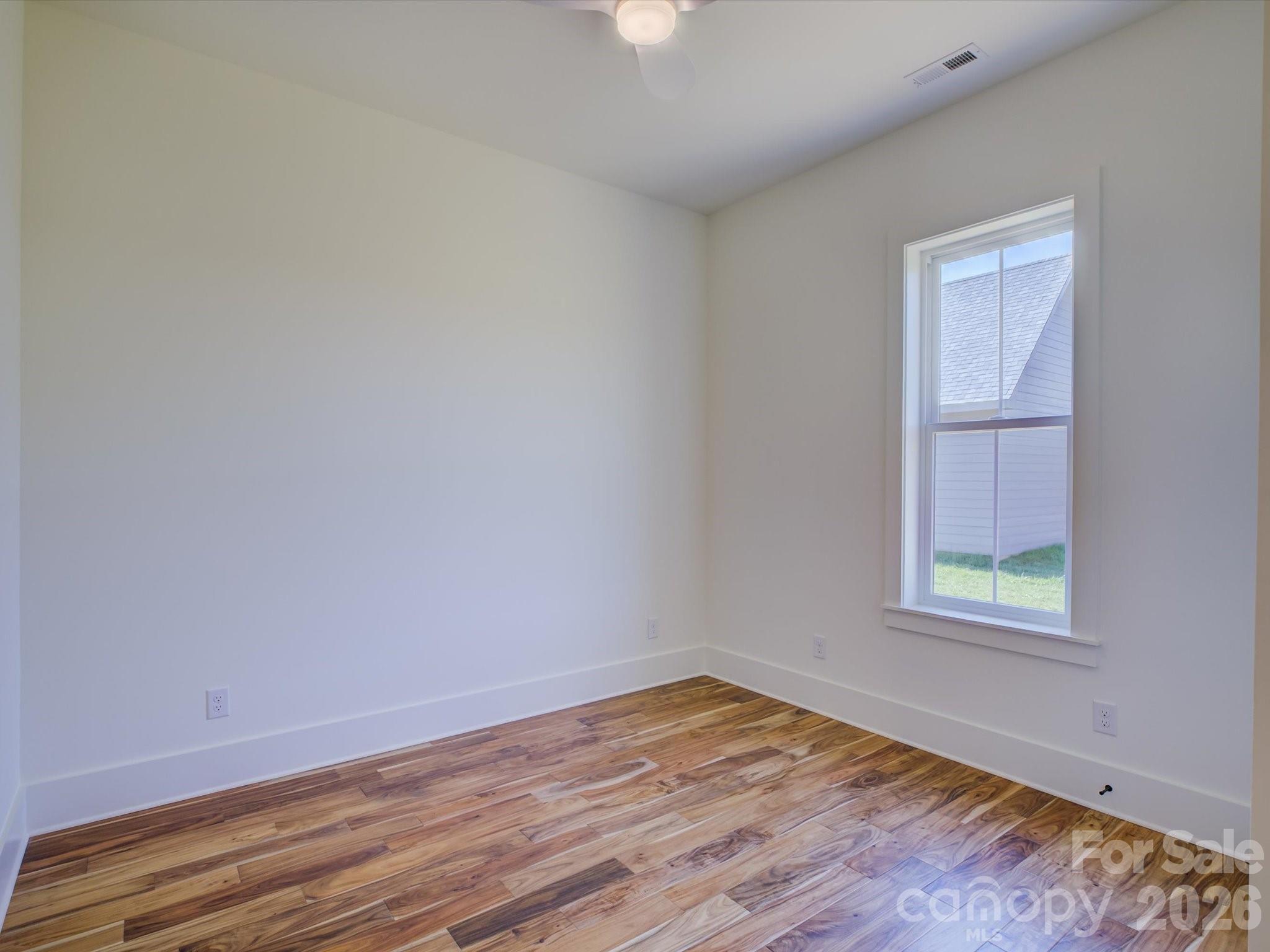 2334 Bridgewater Road, Unit 6 Rock Hill, SC 29730 - Photo 34 of 47 an empty room with wooden floor and windows