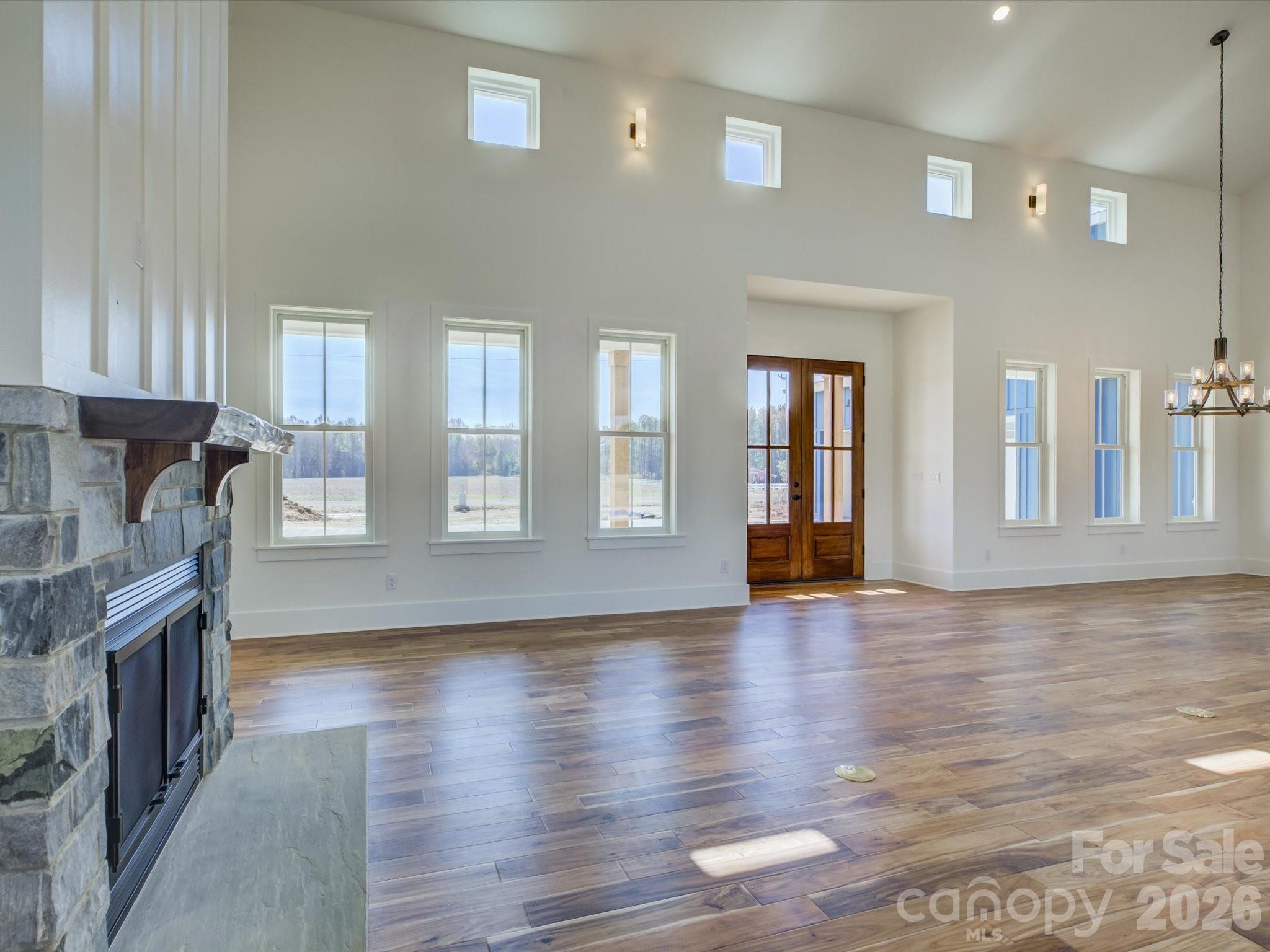 2334 Bridgewater Road, Unit 6 Rock Hill, SC 29730 - Photo 4 of 47 a view of an empty room with wooden floor and a window