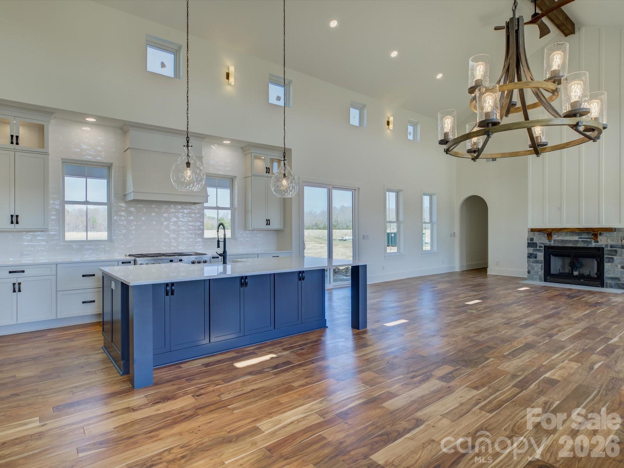 2334 Bridgewater Road, Unit 6 Rock Hill, SC 29730 - Photo 7 of 47 a kitchen with stainless steel appliances granite countertop a refrigerator a sink dishwasher a stove and a dining table with wooden floor