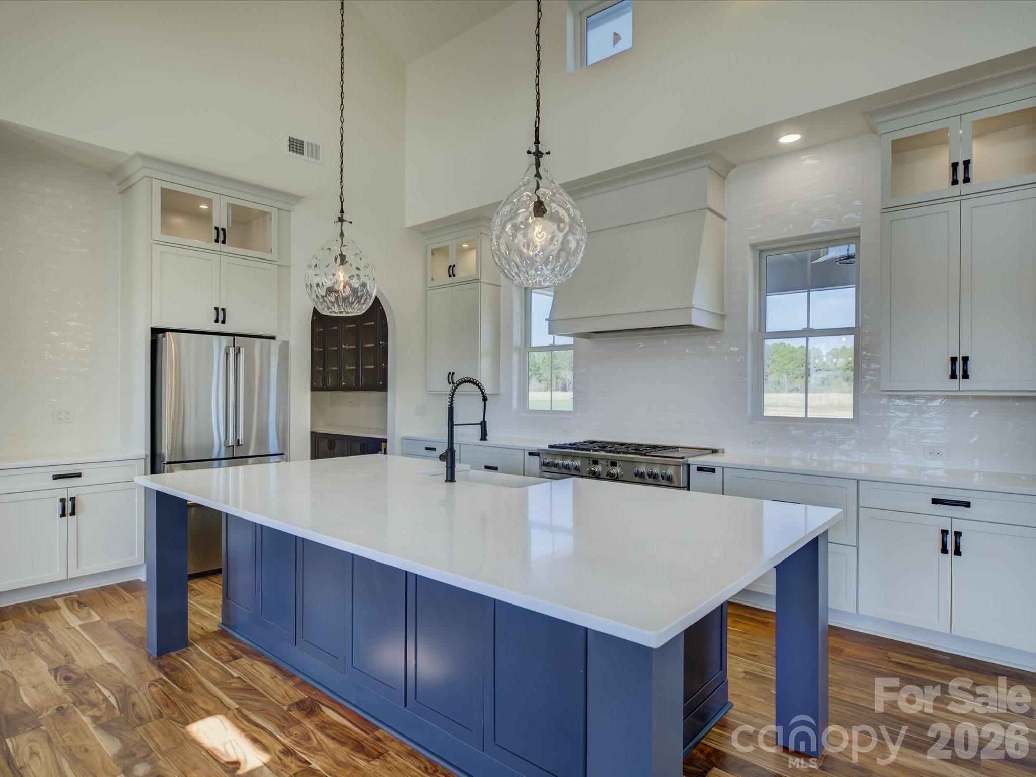 2334 Bridgewater Road, Unit 6 Rock Hill, SC 29730 - Photo 8 of 47 a kitchen with a stove a kitchen island a cabinets and wooden floor