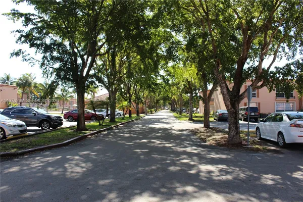 a view of street with parked cars