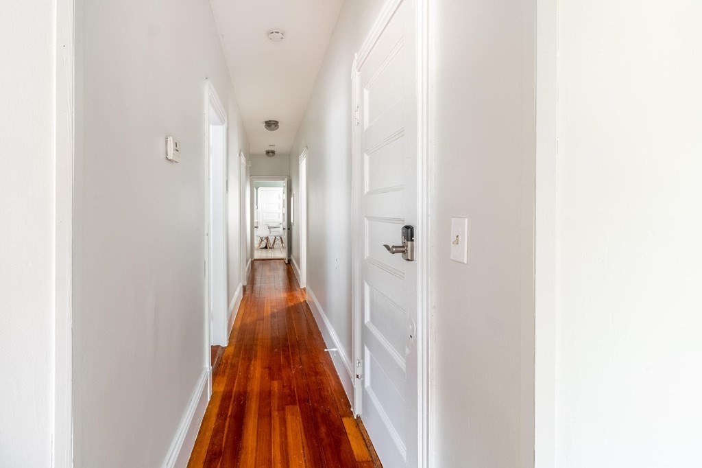 789 Columbia Road, Unit 2 Boston, MA 02125 - Photo 11 of 19 a view of a hallway with wooden floor
