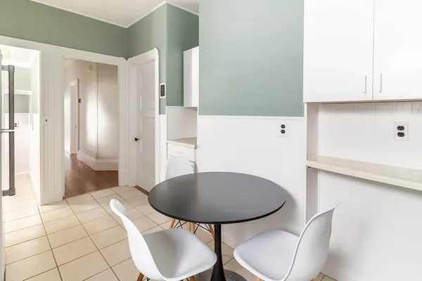 a bathroom with a sink toilet and mirror