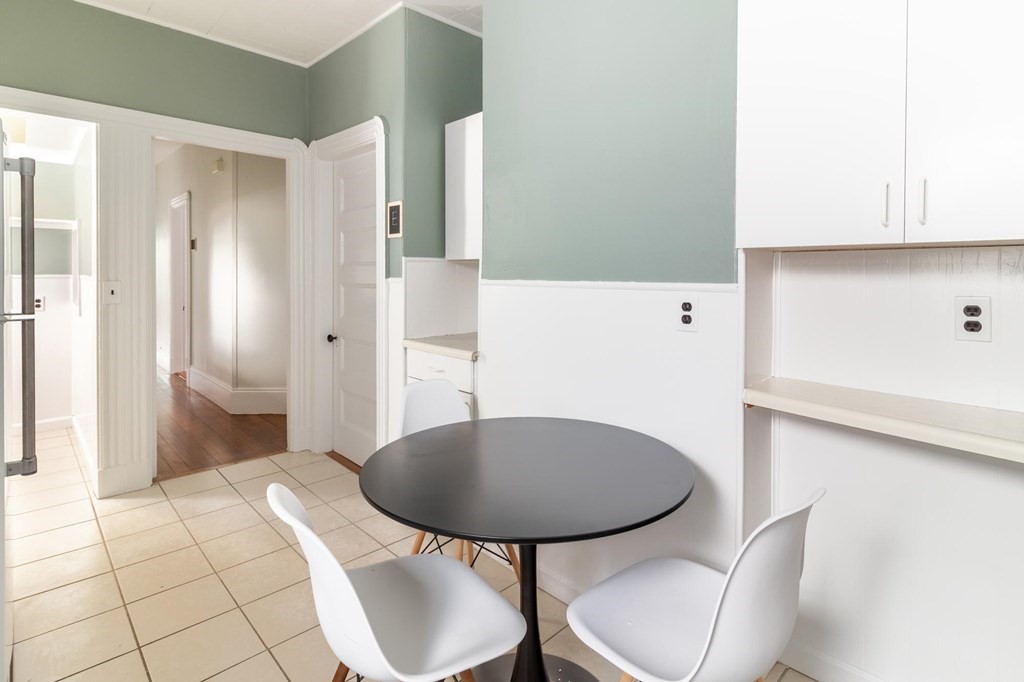 789 Columbia Road, Unit 2 Boston, MA 02125 - Photo 3 of 19 a bathroom with a sink toilet and mirror