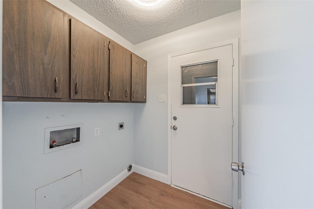 1301 Cedar Ridge Terrace Euless, TX 76039 - Photo 26 of 31 Laundry room leads into two car garage.