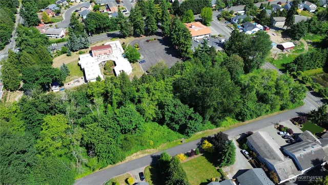 an aerial view of house with yard