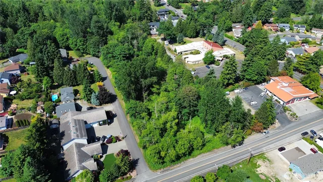 an aerial view of residential house with outdoor space and street view