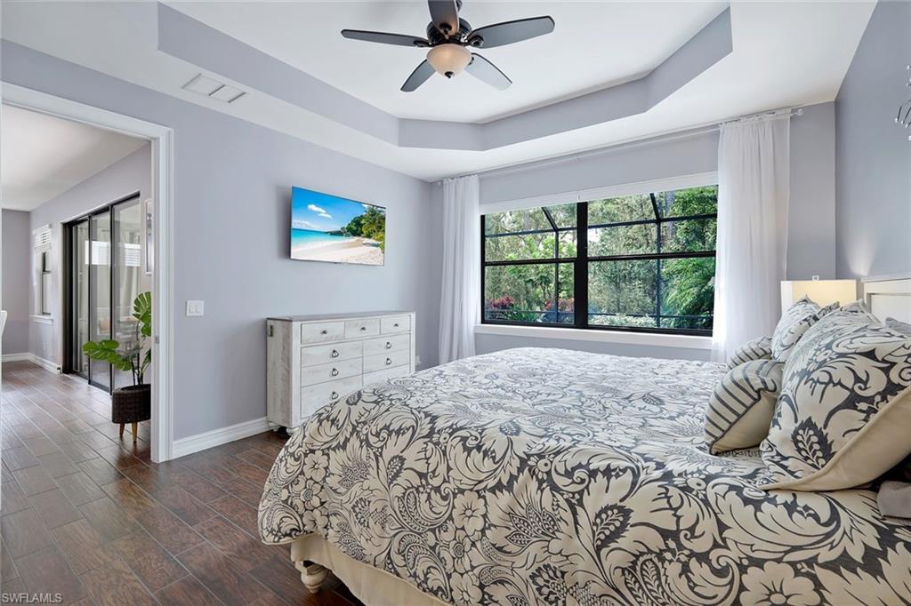 14374 Tuscany Pointe Trail Naples, FL 34120 - Photo 11 of 22 a bedroom with a bed and a window