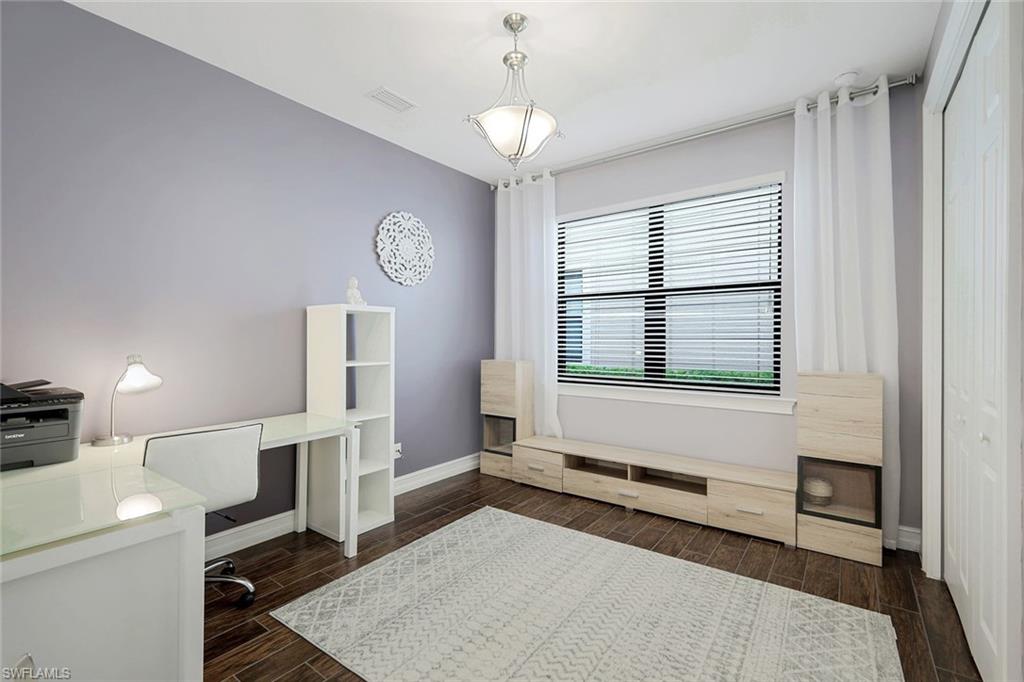 14374 Tuscany Pointe Trail Naples, FL 34120 - Photo 18 of 22 a living room with furniture and a window