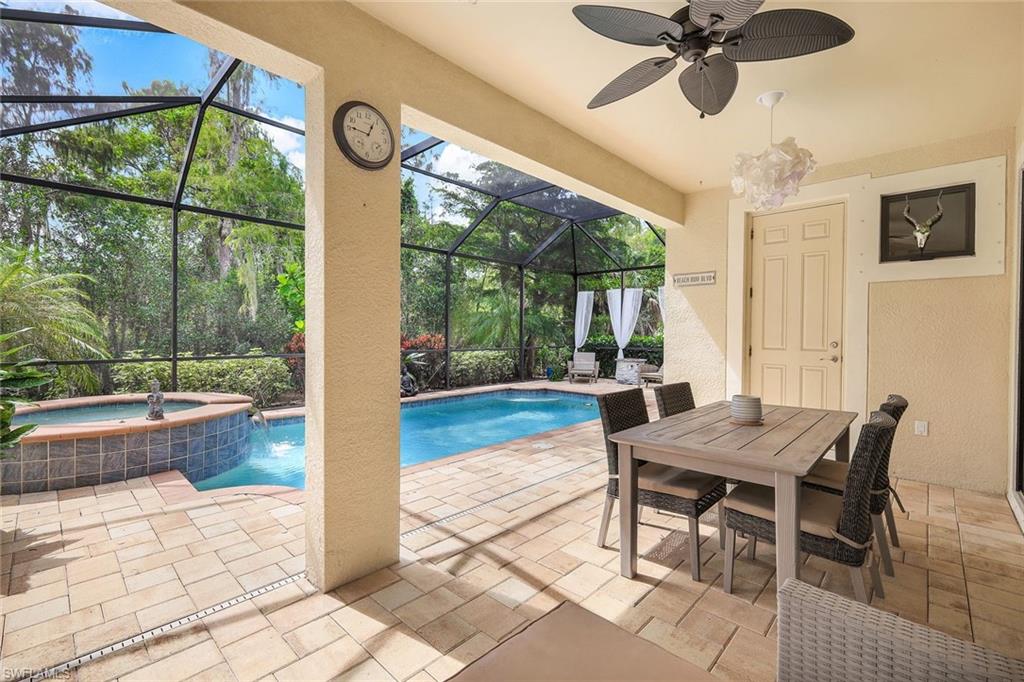 14374 Tuscany Pointe Trail Naples, FL 34120 - Photo 20 of 22 a view of a dining room with furniture window and outside view