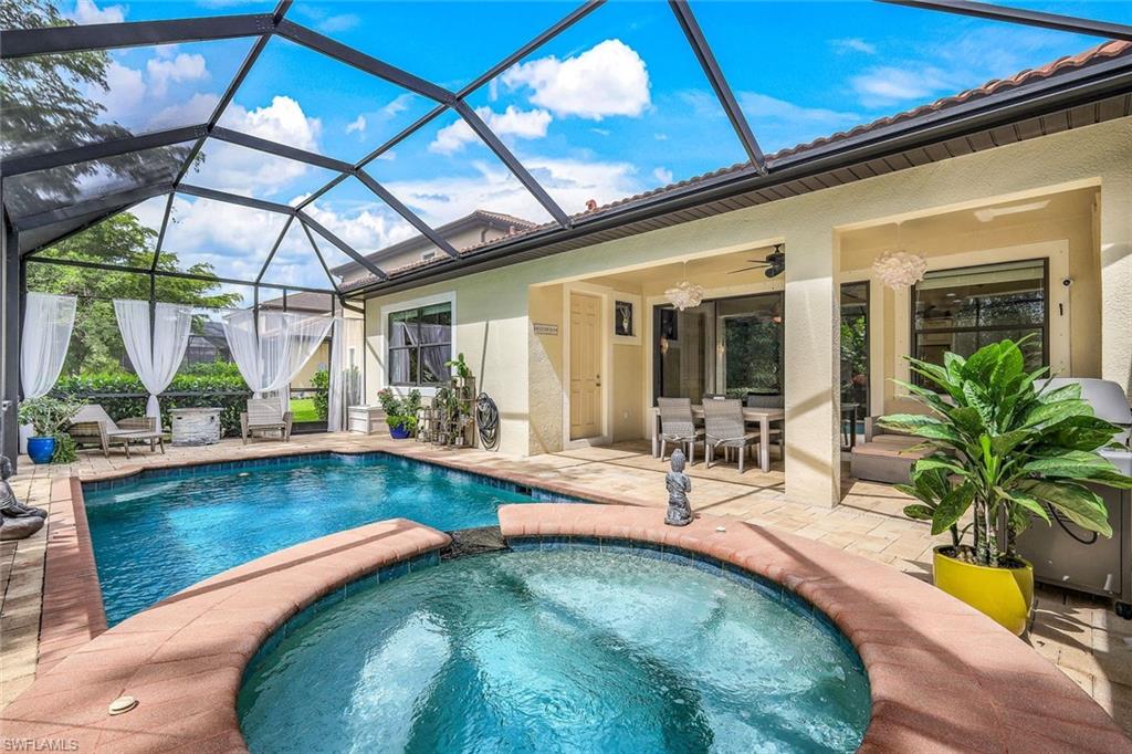 14374 Tuscany Pointe Trail Naples, FL 34120 - Photo 21 of 22 a view of swimming pool with outdoor seating