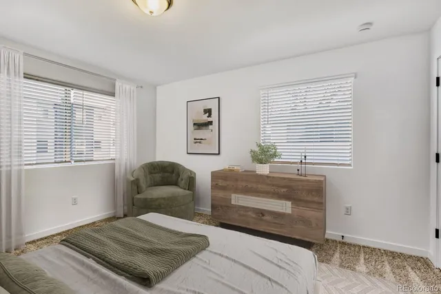 a view of a brick house with large windows