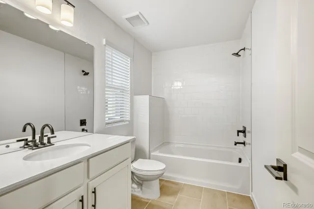 an aerial view of a house with swimming pool garden and patio