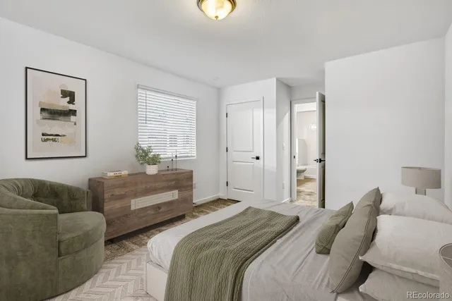 a bedroom with furniture a bed and a couch