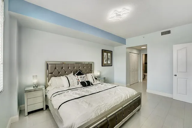 a bathroom with a toilet a sink and a mirror