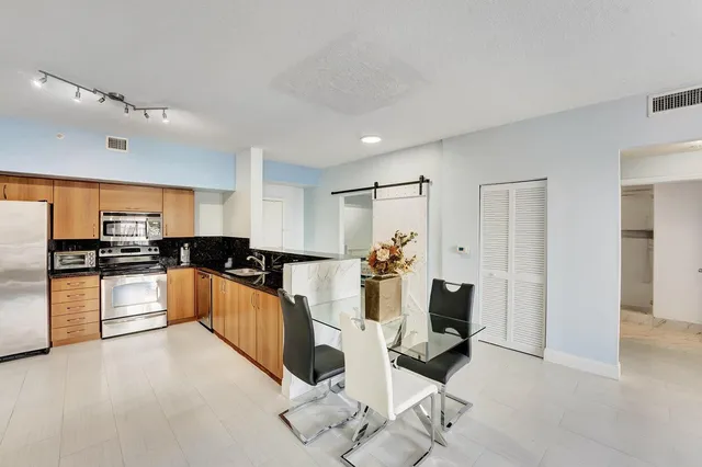 a view of a livingroom with furniture and a window
