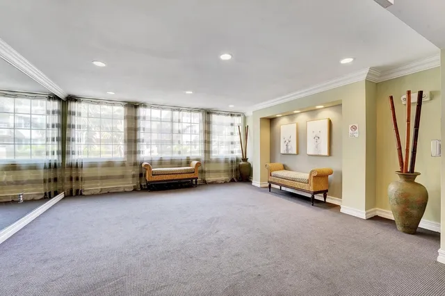 a view of a livingroom with furniture and a window