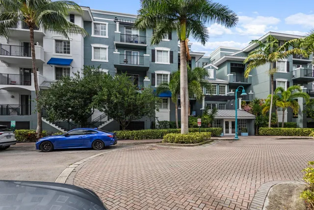 a cars parked in front of brick building