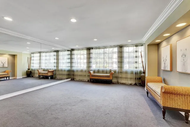 a view of sign board with flower plants