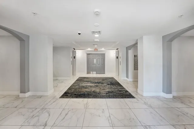 a view of gallery with wooden floor