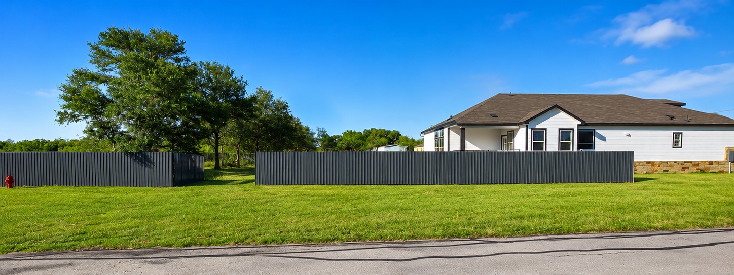 217 Gato Road Cedar Creek, TX 78612 - Photo 37 of 40 a front view of house with yard and trees in the background
