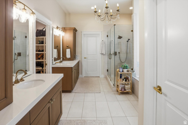 534 East Fish Hatchery Road Mantua, UT 84324 - Photo 45 of 87 Full bathroom featuring a chandelier, a stall shower, two vanities, and light tile patterned floors