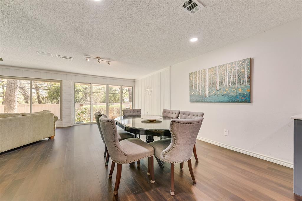 805 Crowley Road Arlington, TX 76012 - Photo 13 of 30 a view of a dining room with furniture and wooden floor